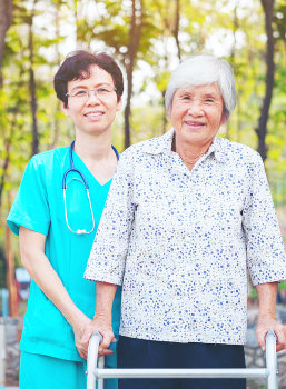 caregiver and senior woman smiling