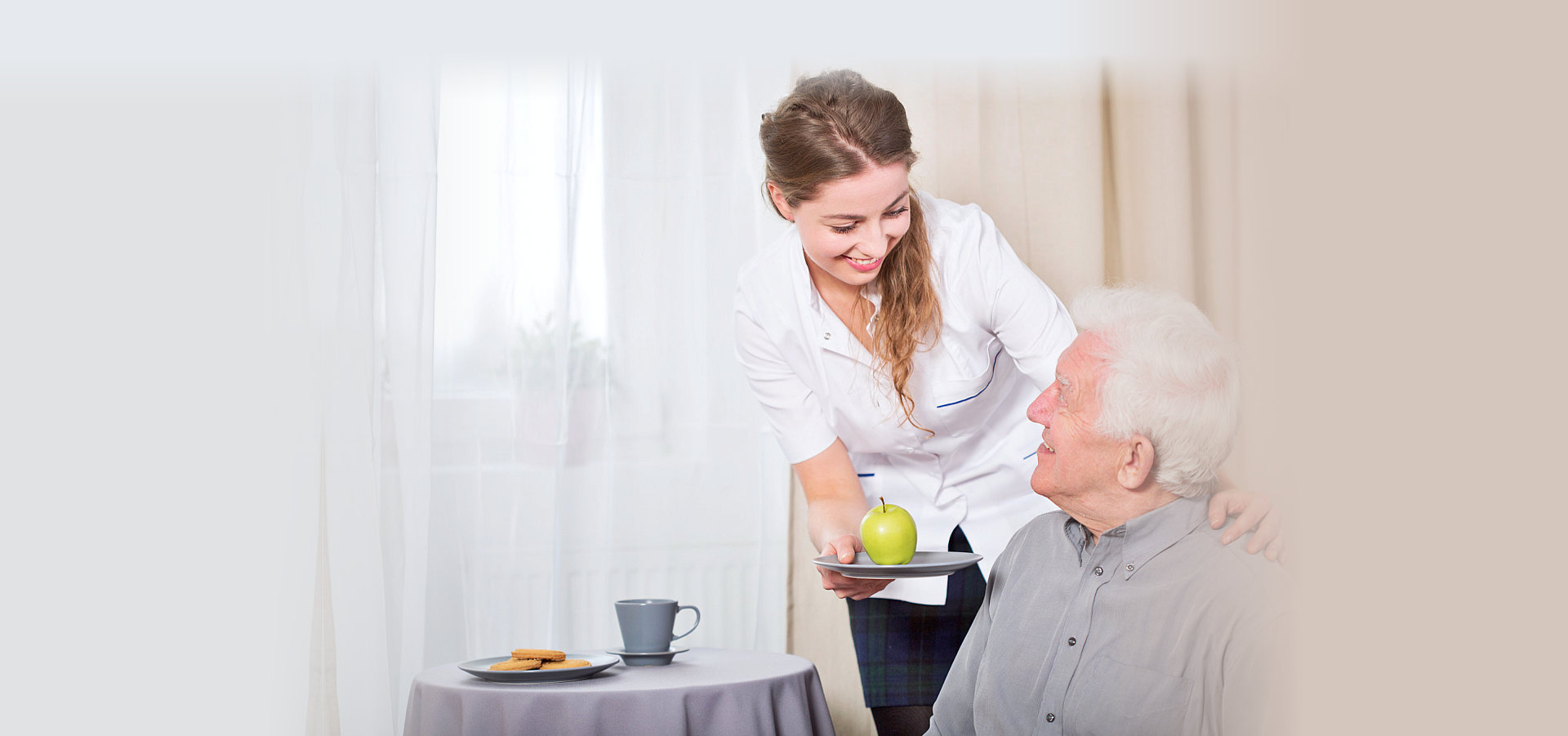 caregiver assisting senior man