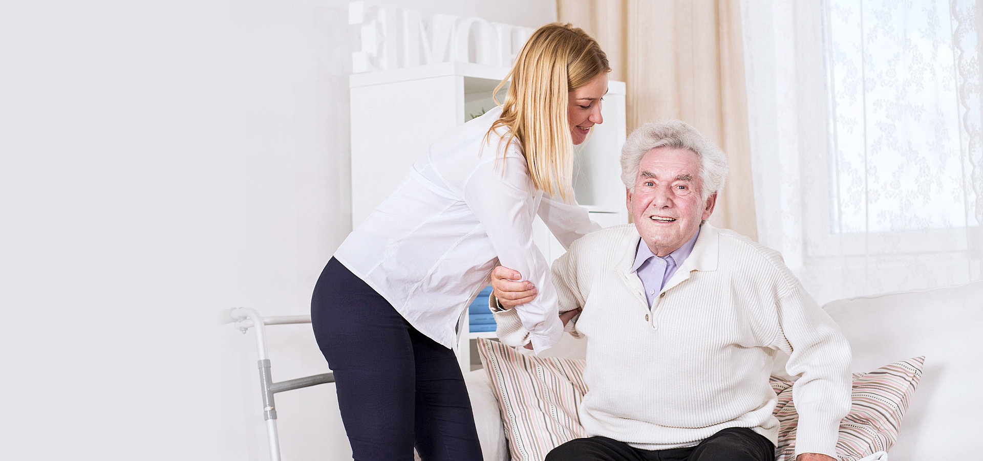caregiver assisting senior man