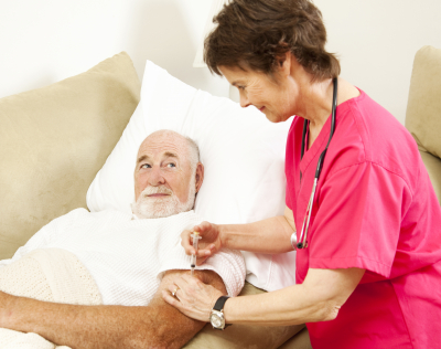 home health nurse add a shot of medicine to an elder patient