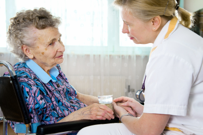 caregiver and elder woman talking