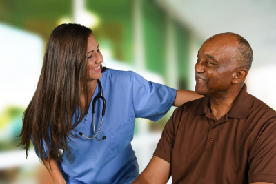 nurse and elder man smiling