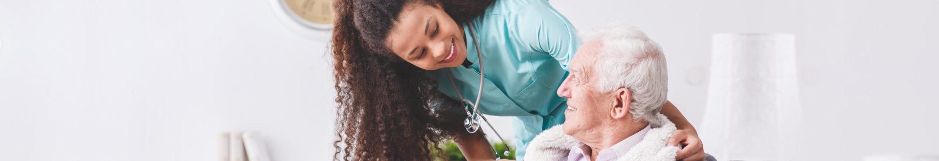 nurse and senior woman smiling